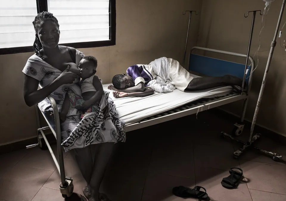 A grandmother breastfeeds her grandson while visiting her sick daughter, Ghana, by Joxe Inazio Kuesta Garmendia